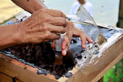 Close-up of man working on wood