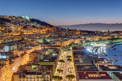 High angle view of illuminated buildings in city