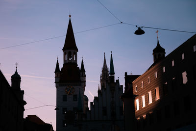 Low angle view of buildings against sky in city