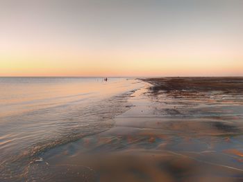 Scenic view of sea against clear sky during sunset