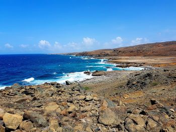 Scenic view of sea against blue sky