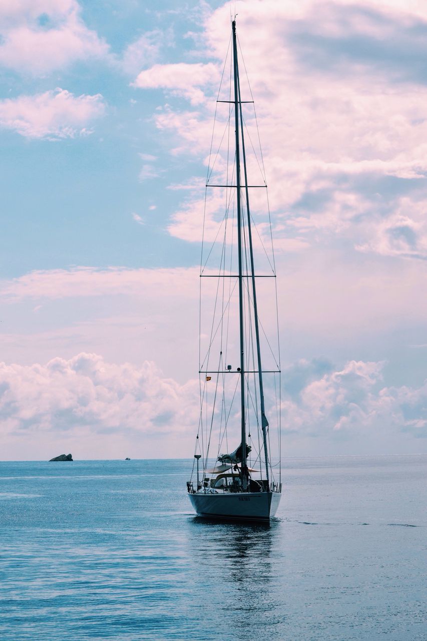 nautical vessel, transportation, sea, sky, mode of transport, boat, sailboat, mast, water, cloud, waterfront, sailing, cloud - sky, journey, ship, nature, scenics, sailing ship, tranquil scene, day, vacations, tranquility, calm, ocean, tourism, beauty in nature, outdoors, majestic, non-urban scene, cumulus cloud, water surface, no people