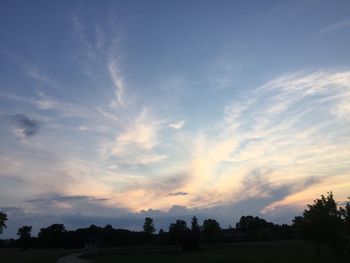 Low angle view of silhouette trees against sky during sunset