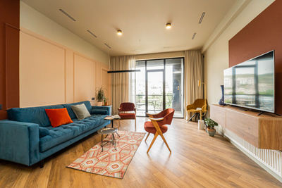 Empty chairs and table in room