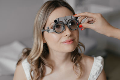 Portrait of young woman wearing sunglasses