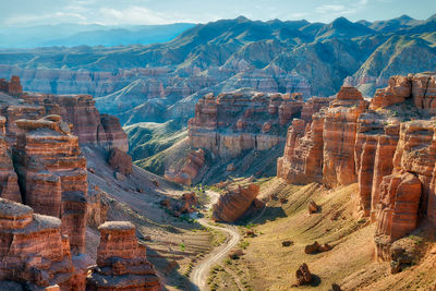 Aerial view of landscape with mountain range in background