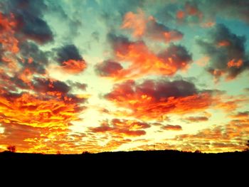 Low angle view of dramatic sky during sunset