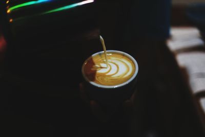 Close-up of cappuccino served on table at cafe