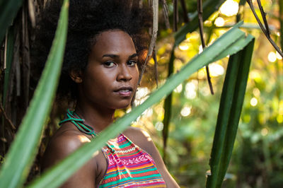 Portrait of young woman looking down