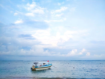 Boat in sea against sky