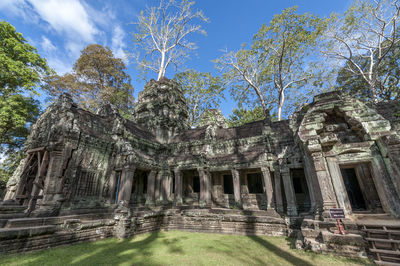 Exterior of historic temple against trees