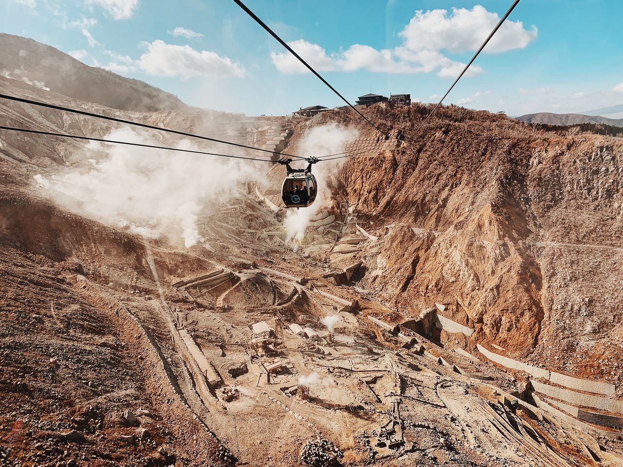 sky, day, nature, cloud - sky, mode of transportation, cable car, cable, transportation, overhead cable car, no people, scenics - nature, outdoors, land, beauty in nature, rock, ski lift, travel, low angle view, solid, mountain, electricity