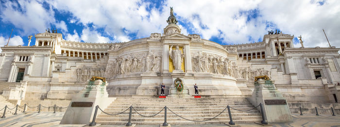 Low angle view of statue against cloudy sky