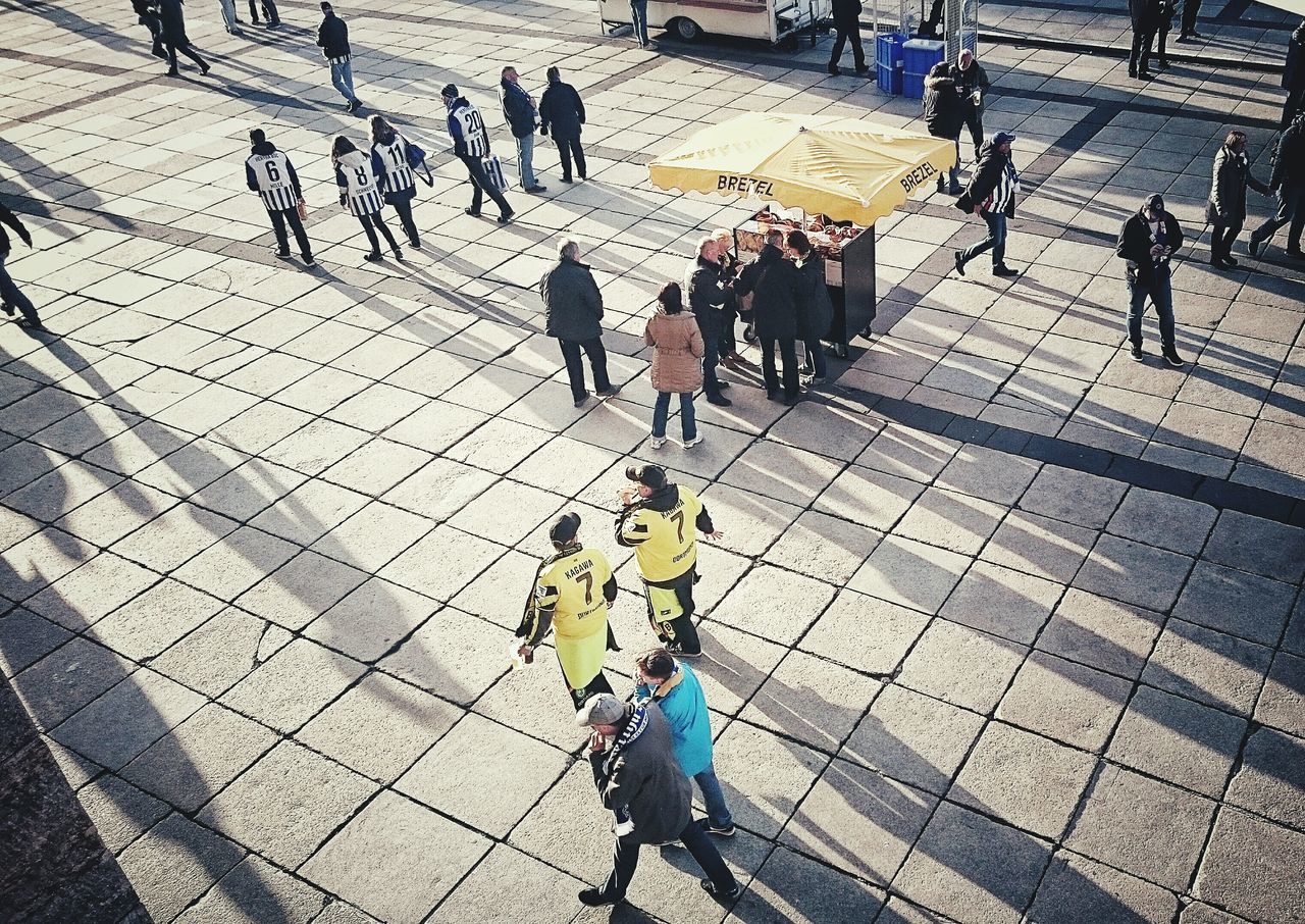 SHADOW OF WOMAN ON FOOTPATH