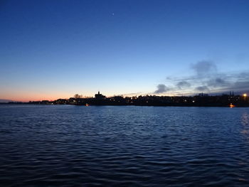 View of illuminated city at sunset