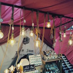 Low angle view of illuminated lanterns hanging from ceiling