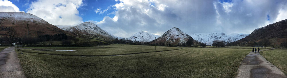 Panoramic view of snowcapped mountains against sky