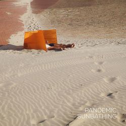 Man relaxing on sand at beach