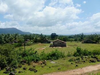 Scenic view of landscape against cloudy sky