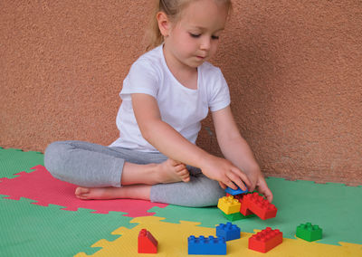Portrait of boy playing with toy blocks
