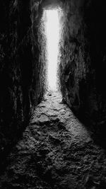 Walkway in illuminated tunnel