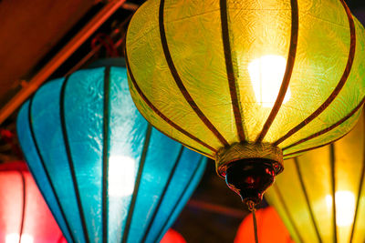 Low angle view of illuminated lanterns hanging in row