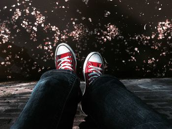 Low section of person standing on road