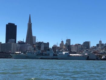 Modern buildings in city against clear sky