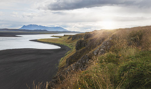 Scenic view of land against sky