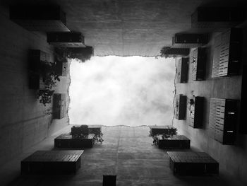 Directly below shot of buildings against sky