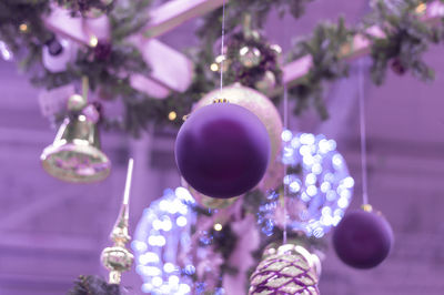 Close-up of christmas decoration hanging on plant