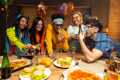 Friends having food at restaurant