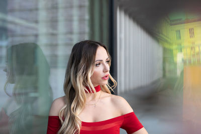 Portrait of young woman looking away