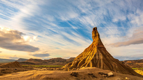 View of rock formations on landscape against sky