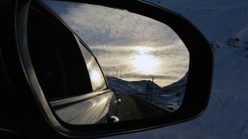 Close-up of side-view mirror of car