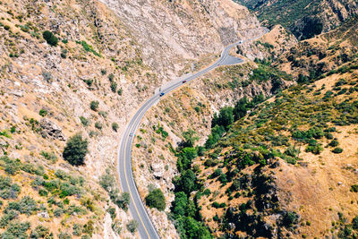 High angle view of road amidst mountains