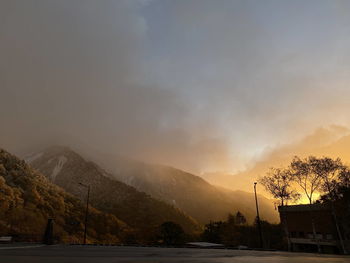 Scenic view of mountains against sky during sunset