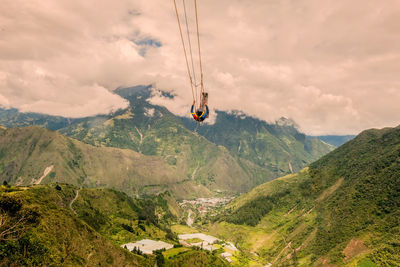 Scenic view of overhead cable car against mountains