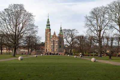 View of trees and buildings against sky