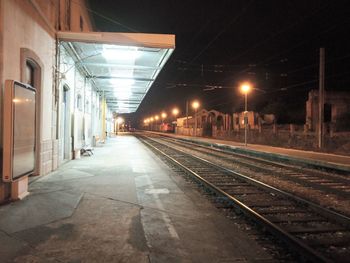 View of railroad station platform at night