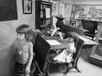 Girl sitting on chair at home