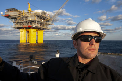 Portrait of man in sea against sky