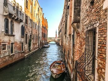 Canal amidst buildings in city
