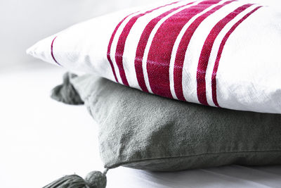 Low section of woman sitting on sofa at home