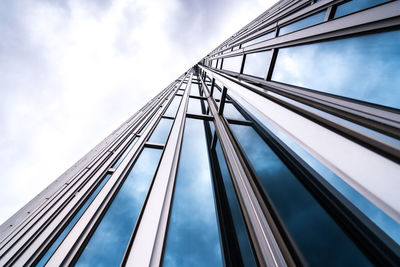 Low angle view of building against cloudy sky