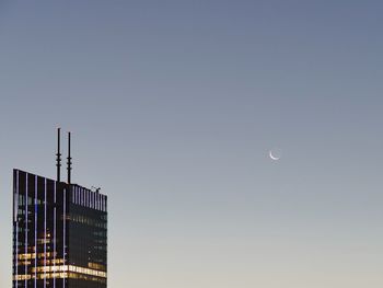 Low angle view of full moon in sky at night