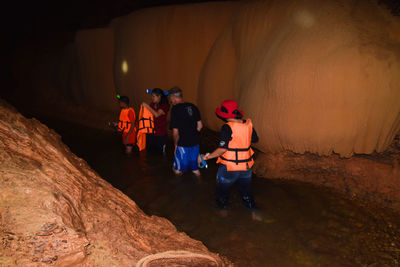People walking in cave