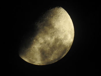 Low angle view of moon against dark sky