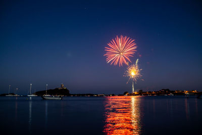 Firework display over nora bay, sardinia