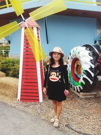 Portrait of smiling girl standing outdoors